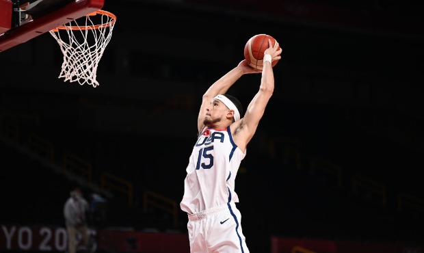 Devin Booker #15 of Team United States dunks against Islamic Republic of Iran during a Men's Prelim...
