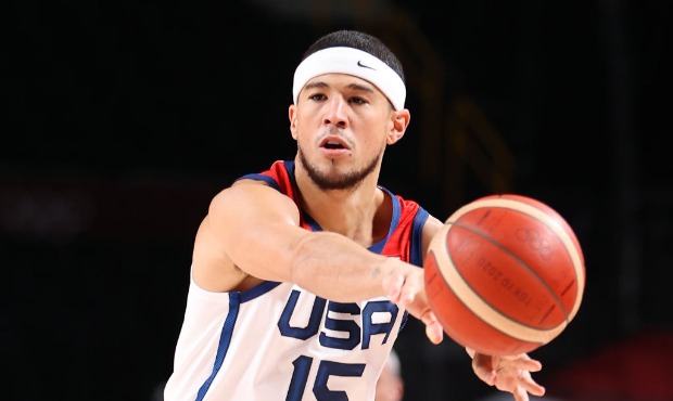 Devin Booker #15 of Team United States passes the ball against Czech Republic during the first half...