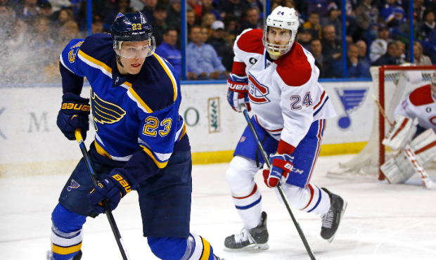 St. Louis Blues' Dmitrij Jaskin, left, of Russia, handles the puck as Montreal Canadiens' Jarred Ti...