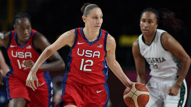 United States' Diana Taurasi (12) drives up the court during women's basketball preliminary round g...
