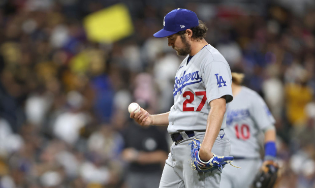 Trevor Bauer #27 of the Los Angeles Dodgers looks on after allowing a solo homerun to Victor Carati...