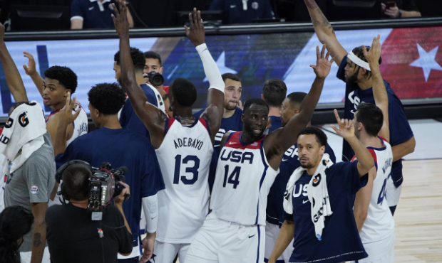 United States players celebrate after defeating Spain in an exhibition basketball game in preparati...