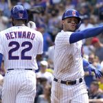 Chicago Cubs' Willson Contreras, right, celebrates with Jason Heyward after hitting a solo home run during the fourth inning of a baseball game against the Arizona Diamondbacks in Chicago, Saturday, July 24, 2021. (AP Photo/Nam Y. Huh)