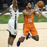 Phoenix Suns guard Cameron Payne (15) drives to the basket ahead of Milwaukee Bucks guard Jeff Teague (5) during the first half of Game 4 of basketball's NBA Finals in Milwaukee, Wednesday, July 14, 2021. (AP Photo/Paul Sancya)