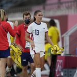 
              United States' Alex Morgan leaves the field during second half of a women's soccer match against Australia at the 2020 Summer Olympics, Tuesday, July 27, 2021, in Kashima, Japan. (AP Photo/Fernando Vergara)
            