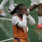 Phoenix Suns forward Jae Crowder (99) reacts during the second half against the Milwaukee Bucks in Game 4 of basketball's NBA Finals Wednesday, July 14, 2021, in Milwaukee. (AP Photo/Aaron Gash)