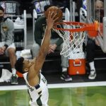 Milwaukee Bucks forward Giannis Antetokounmpo dunks the ball during the second half against the Phoenix Suns in Game 4 of basketball's NBA Finals in Milwaukee, Wednesday, July 14, 2021. (AP Photo/Paul Sancya)