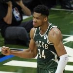 Milwaukee Bucks forward Giannis Antetokounmpo reacts to a basket against the Phoenix Suns during the first half of Game 3 of basketball's NBA Finals in Milwaukee, Sunday, July 11, 2021. Milwaukee won 120-100. (AP Photo/Paul Sancya)