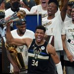 Milwaukee Bucks forward Giannis Antetokounmpo (34) holds the finals MVP trophy after the Bucks defeated the Phoenix Suns in Game 6 of basketball's NBA Finals in Milwaukee, Tuesday, July 20, 2021. The Bucks won 105-98. (AP Photo/Paul Sancya)