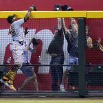 Pittsburgh Pirates right fielder Gregory Polanco is unable to make a catch on a home run hit by Arizona Diamondbacks' Daulton Varsho during the seventh inning of a baseball game, Wednesday, July 21, 2021, in Phoenix. The Diamondbacks won 6-4. (AP Photo/Ross D. Franklin)