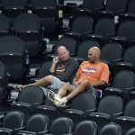 Phoenix Suns fans remain in their seats after the Milwaukee Bucks defeated the Suns in Game 5 of basketball's NBA Finals, Saturday, July 17, 2021, in Phoenix. (AP Photo/Ross D. Franklin)