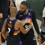 Phoenix Suns guard Chris Paul, left, celebrates with Jae Crowder after the Suns defeated the Milwaukee Bucks in Game 2 of basketball's NBA Finals, Thursday, July 8, 2021, in Phoenix. (AP Photo/Matt York)