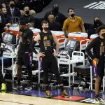 Phoenix Suns players react during the second half of Game 5 of basketball's NBA Finals against the Milwaukee Bucks, Saturday, July 17, 2021, in Phoenix. (AP Photo/Matt York)