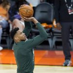 Milwaukee Bucks forward Giannis Antetokounmpo warms up prior to Game 1 of basketball's NBA Finals against the Phoenix Suns, Tuesday, July 6, 2021, in Phoenix. (AP Photo/Ross D. Franklin)