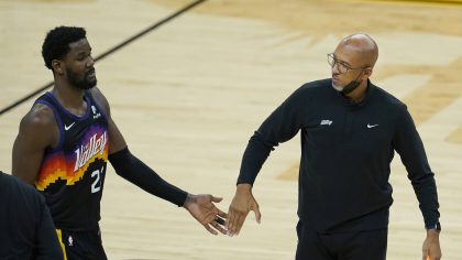 Phoenix Suns center Deandre Ayton, left, reacts with head coach Monty Williams during the first hal...