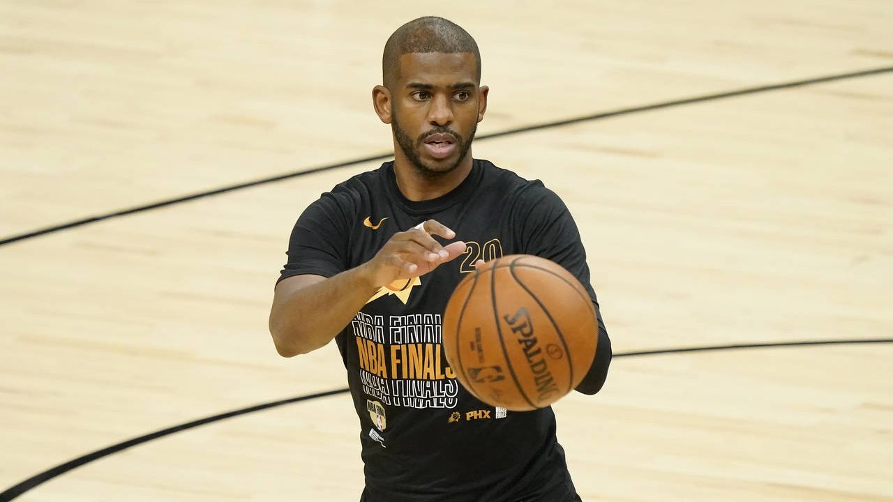 Phoenix Suns guard Chris Paul warms up before Game 5 of basketball's NBA Finals against the Milwauk...