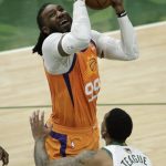Phoenix Suns forward Jae Crowder (99) drives to the basket over Milwaukee Bucks guard Jeff Teague (5) during the first half of Game 4 of basketball's NBA Finals Wednesday, July 14, 2021, in Milwaukee. (AP Photo/Aaron Gash)