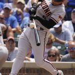 Arizona Diamondbacks' Eduardo Escobar hits a double during the first inning of a baseball game against the Chicago Cubs in Chicago, Saturday, July 24, 2021. (AP Photo/Nam Y. Huh)