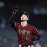 Arizona Diamondbacks' Pavin Smith points to the sky as he arrives at home plate after hitting a home run against the Pittsburgh Pirates during the seventh inning of a baseball game Wednesday, July 21, 2021, in Phoenix. The Diamondbacks defeated the Pirates 6-4. (AP Photo/Ross D. Franklin)