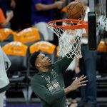 Milwaukee Bucks forward Giannis Antetokounmpo warms up before Game 2 of basketball's NBA Finals against the Phoenix Suns, Thursday, July 8, 2021, in Phoenix. (AP Photo/Ross D. Franklin)