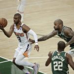 Phoenix Suns' Chris Paul (3) goes to the basket during the first half of Game 3 of basketball's NBA Finals against the Milwaukee Bucks, Sunday, July 11, 2021, in Milwaukee. (AP Photo/Aaron Gash)