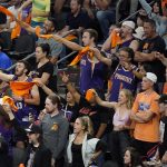 Fans cheer during the second half of Game 2 of basketball's NBA Finals between the Phoenix Suns and the Milwaukee Bucks, Thursday, July 8, 2021, in Phoenix. (AP Photo/Matt York)
