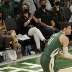 Milwaukee Bucks' Brook Lopez claps after making a shot during the second half of Game 3 of basketball's NBA Finals against the Phoenix Suns, Sunday, July 11, 2021, in Milwaukee. (AP Photo/Aaron Gash)