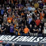 Fans cheer prior to game 1 of basketball's NBA Finals between the Milwaukee Bucks and the Phoenix Suns, Tuesday, July 6, 2021, in Phoenix. (AP Photo/Matt York, Pool)