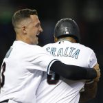 Arizona Diamondbacks' David Peralta (6) celebrates with Nick Ahmed after being hit by a pitch with the bases loaded to give the team a 4-3 win over the Colorado Rockies in a baseball game Tuesday, July 6, 2021, in Phoenix. (AP Photo/Ralph Freso)