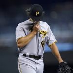 Pittsburgh Pirates starting pitcher Max Kranick walks off the field after being removed in the fourth inning of a baseball game against the Arizona Diamondbacks, Wednesday, July 21, 2021, in Phoenix. (AP Photo/Ross D. Franklin)