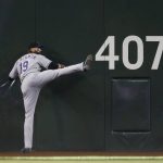 Colorado Rockies outfielder Charlie Blackmon stretches in center field prior to the team's baseball game against the Arizona Diamondbacks, Tuesday, July 6, 2021, in Phoenix. (AP Photo/Ralph Freso)