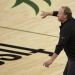 Milwaukee Bucks head coach Mike Budenholzer gestures from the sideline during the second half of Game 3 of basketball's NBA Finals against the Phoenix Suns, Sunday, July 11, 2021, in Milwaukee. (AP Photo/Aaron Gash)