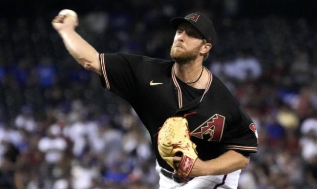 Arizona Diamondbacks pitcher Merrill Kelly throws to a Los Angeles Dodgers batter during the first ...