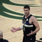 Milwaukee Bucks center Brook Lopez (11) reacts during the first half of Game 6 of basketball's NBA Finals against the Phoenix Suns Tuesday, July 20, 2021, in Milwaukee. (AP Photo/Aaron Gash)