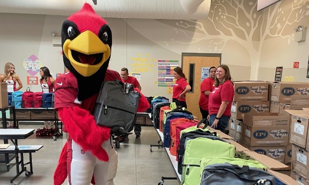 The Arizona Cardinals and State Farm give back to the community by gifting 567 backpacks to the Lai...