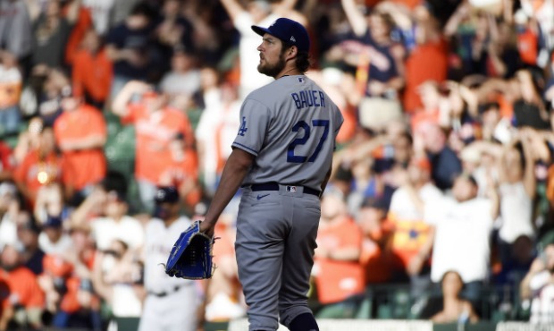 Los Angeles Dodgers starting pitcher Trevor Bauer (27) watches the solo home run of Houston Astros'...