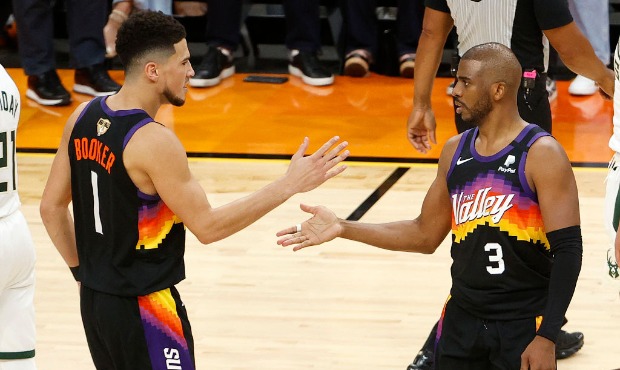 Devin Booker #1 and Chris Paul #3 of the Phoenix Suns celebrate during the second half in Game One ...