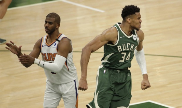 Milwaukee Bucks' Giannis Antetokounmpo (34) reacts after a dunk during the second half of Game 3 of...