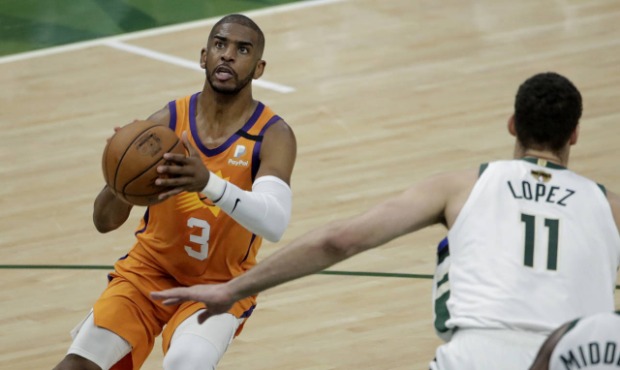 Phoenix Suns guard Chris Paul (3) shoots over Milwaukee Bucks center Brook Lopez (11) during the fi...