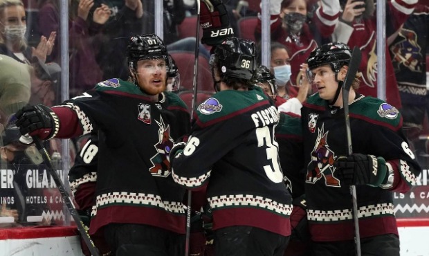 Arizona Coyotes left wing Lawson Crouse (67), Coyotes right wing Christian Fischer (36), and Coyote...