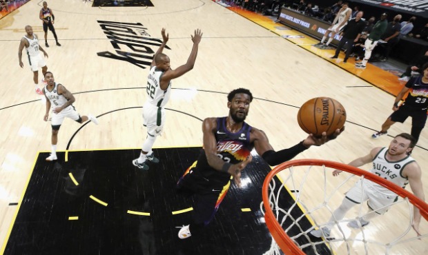 Phoenix Suns' Deandre Ayton (22) shoots against the Milwaukee Bucks during the first half of Game 1...