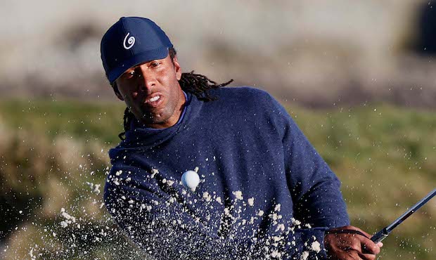 FEBRUARY 10: Larry Fitzgerald of the NFL Arizona Cardinals hits the ball out of a sand trap on 17th...