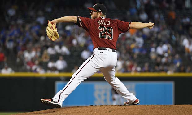 Merrill Kelly #29 of the Arizona Diamondbacks delivers a first inning pitch against the Chicago Cub...