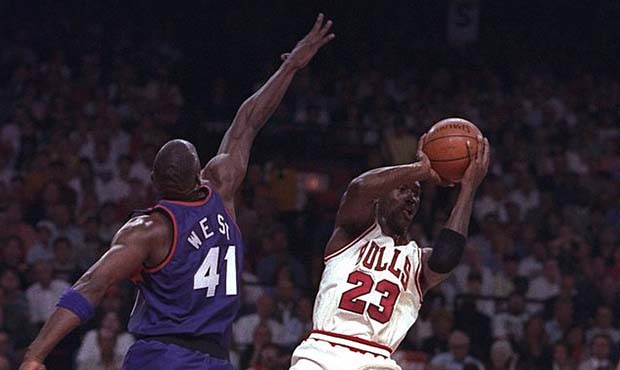 18 Jun 1993: Guard Michael Jordan of the Chicago Bulls (right) goes up for two during Game Five of ...