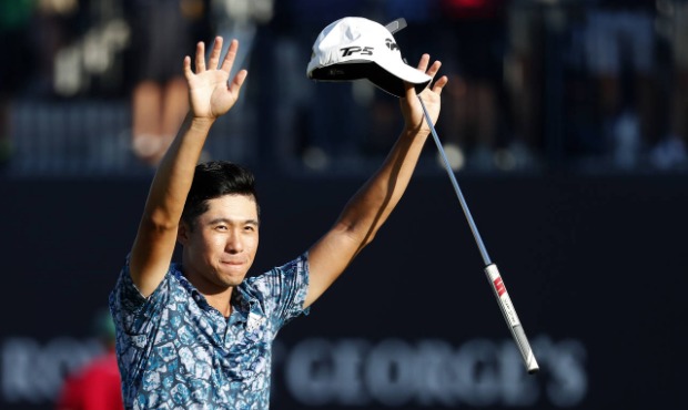 United States' Collin Morikawa celebrates on the 18th green after winning the British Open Golf Cha...