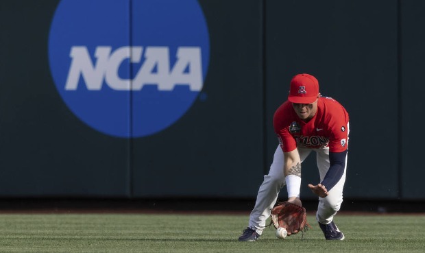 Arizona's Ryan Holgate fields a hit by Vanderbilt's Dominic Keegan during the first inning of a bas...