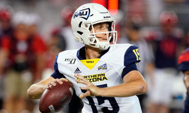 Northern Arizona quarterback Case Cookus looks down field against Arizona in the first half during ...