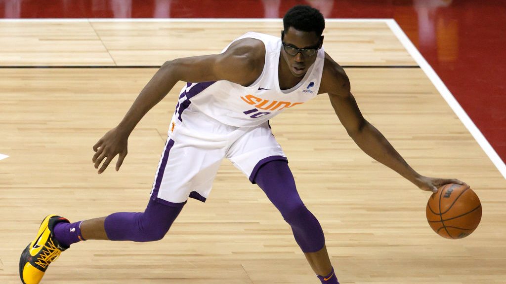 Jalen Smith #10 of the Phoenix Suns grabs a loose ball against the Los Angeles Lakers during the 20...