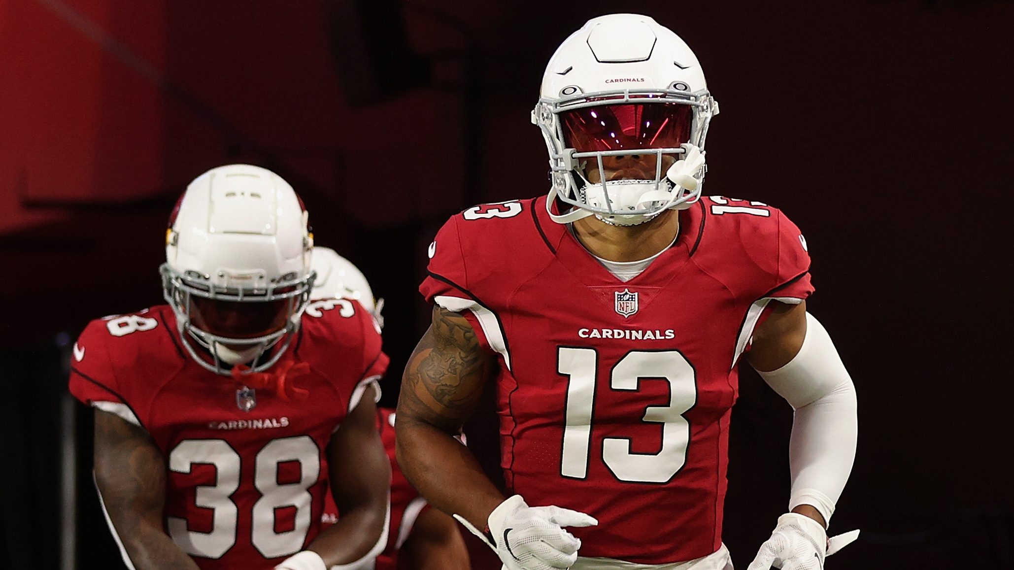 Wide receiver Christian Kirk #13 and safety James Wiggins #38 of the Arizona Cardinals run onto the...