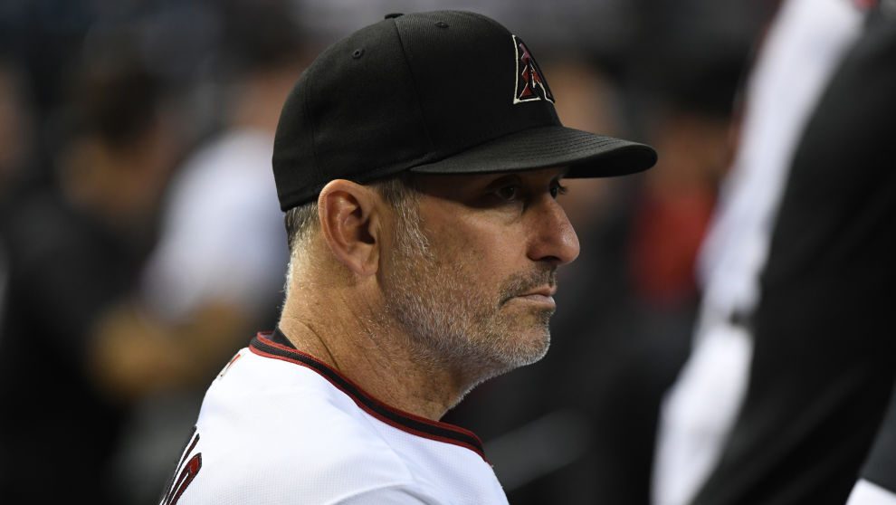 Manager Torey Lovullo #17 of the Arizona Diamondbacks looks on from the bench against the Philadelp...